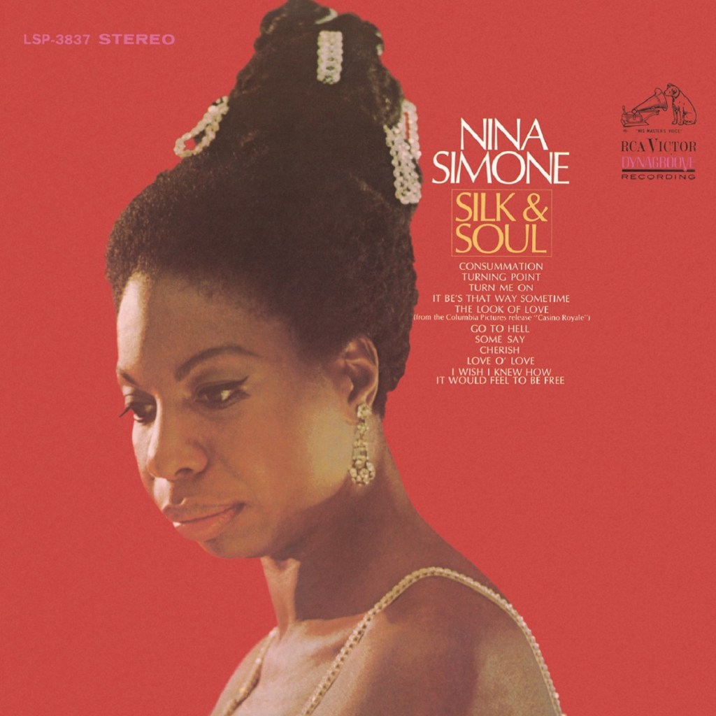 Album cover in red with Nina Simone facing right looking down to the left with a sombre expression.
